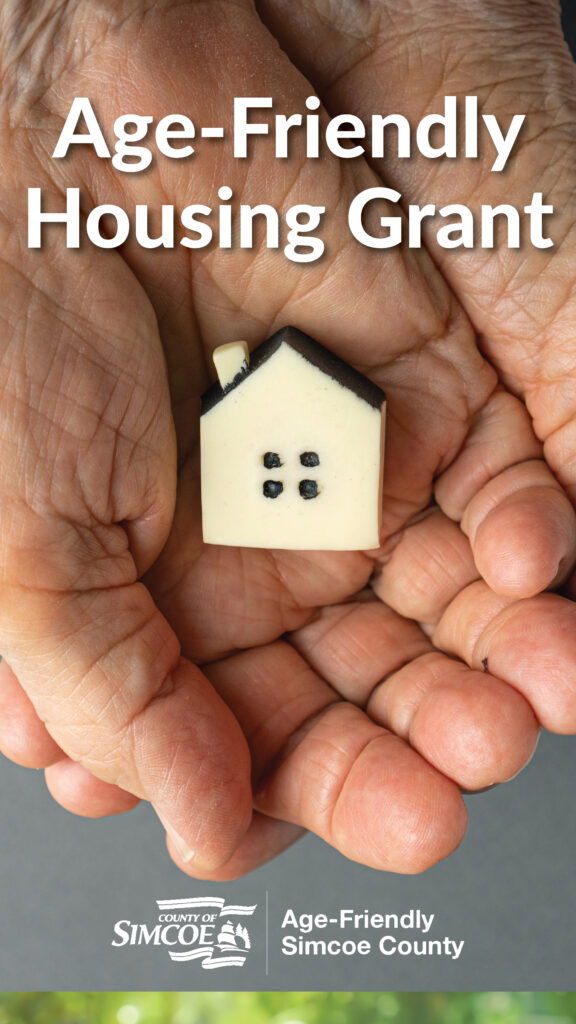 County launches 2024 Age-Friendly Seniors Housing Grant Program graphic. Photo used shows two hands holding a house-shaped block.