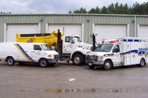 Three of the County Fleet vehicle's. Ambulance, Snow plough and cargo van.